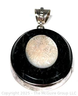 Oval Onyx with Carved Mother of Pearl Set in Sterling Silver Pendant.  