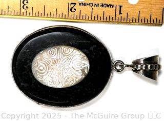 Oval Onyx with Carved Mother of Pearl Set in Sterling Silver Pendant.  