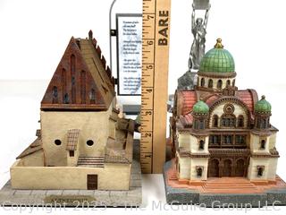 Collection of Travel Souvenirs Including Coin Banks and Figurines of Buildings