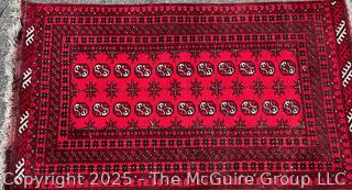 Hand-knotted Afghan Akhche Wool Rug on Red Ground. 40" x 76"