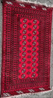 Hand-knotted Afghan Akhche Wool Rug on Red Ground. 40" x 76"
