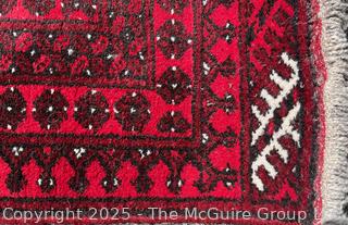 Hand-knotted Afghan Akhche Wool Rug on Red Ground. 40" x 76"