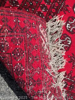 Hand-knotted Afghan Akhche Wool Rug on Red Ground. 40" x 76"
