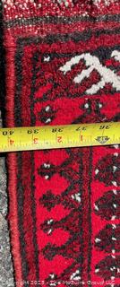 Hand-knotted Afghan Akhche Wool Rug on Red Ground. 40" x 76"