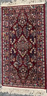 Wool Karastan Sarouk Pattern Area Rug on Red Ground.  2.2' x 4'