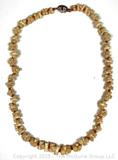 Turned and Carved Graduated Bone and Coral Bead Necklace with 14KT Yellow Gold Clasp.  22"