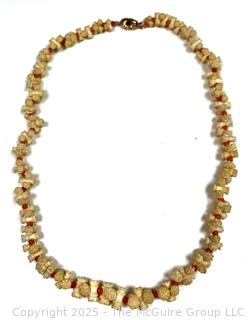 Turned and Carved Graduated Bone and Coral Bead Necklace with 14KT Yellow Gold Clasp.  22"