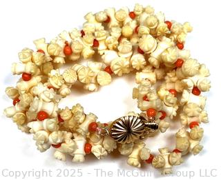 Turned and Carved Graduated Bone and Coral Bead Necklace with 14KT Yellow Gold Clasp.  22"
