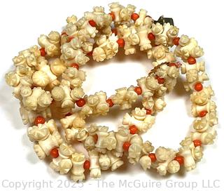 Turned and Carved Graduated Bone and Coral Bead Necklace with 14KT Yellow Gold Clasp.  22"