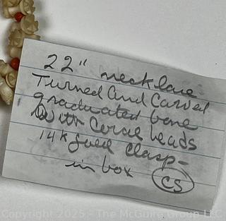 Turned and Carved Graduated Bone and Coral Bead Necklace with 14KT Yellow Gold Clasp.  22"