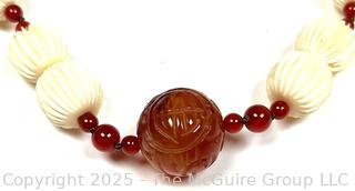 Graduated Carved Bone Bead Necklace with Carnelian Stone Center