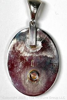 Sterling Silver with Lapis Lazuli Center Pendant.