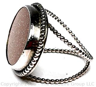 Sterling Silver Ring with Goldstone Center. 