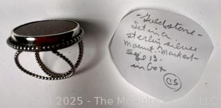 Sterling Silver Ring with Goldstone Center. 
