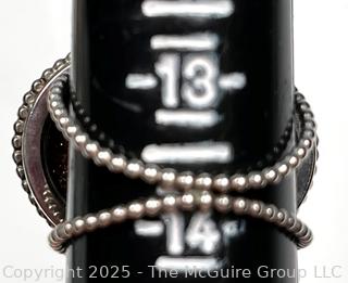 Sterling Silver Ring with Goldstone Center. 