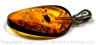 Polished Amber Pendant on Sterling Silver Bale