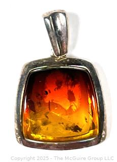 Polished Amber in Sterling Silver Surround Pendant.