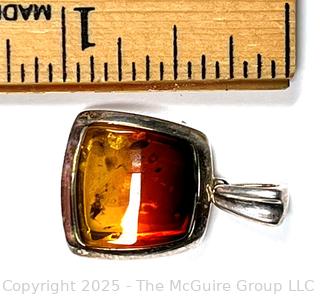 Polished Amber in Sterling Silver Surround Pendant.