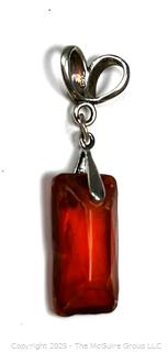 Hand Carved Amber Stone Pendant on Silver Bale. 