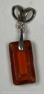 Hand Carved Amber Stone Pendant on Silver Bale. 