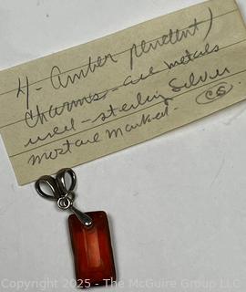 Hand Carved Amber Stone Pendant on Silver Bale. 