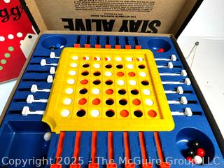 Four (4) Board Games Including Stay Alive, Aggravation, Monopoly and Scrabble