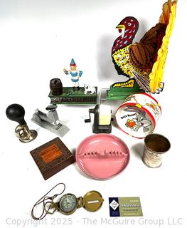 Compass, Horn, Decorations, Stapler, Pencil Sharpener, Cast Iron Bank, Trinket Box. 