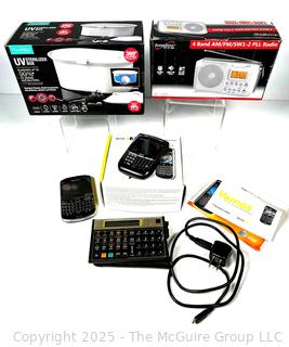 SuperSonic 4 Band Radio, Blackberry Bold, NuvoMed Sterilizer Box, Pocket Calculator and Phone