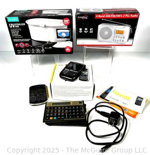 SuperSonic 4 Band Radio, Blackberry Bold, NuvoMed Sterilizer Box, Pocket Calculator and Phone