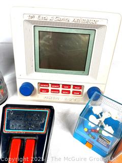 Hand-Held Games Including Puzzles, Sound Gizmo, The Etch A Sketch Animator, Travel Battleship, TOMY and Electronic Pinball, Untested