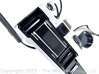 Canon AE-1 35mm Film Camera With a Canon FD 50mm 1:1.8 Lens