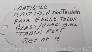 Set of Four (4) Cast Iron Northwind Face Eagle Talon Glass Ball Table Feet