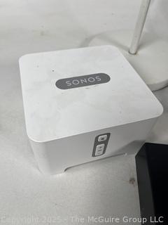 LG Blue-ray Player, SONOS Audio Amplifier, Speakers, and Remotes.