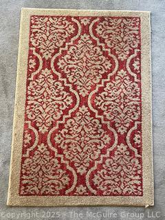 Red on Beige Ground Patterned Area Rug. 30" x 45"  {Pickup Location: 311 Chestnut St., Falls Church City, VA 22046}