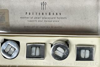 Three (3) Boxes of Shirley Pewter Shops Napkin Holders and Three (3) Boxes Pottery Barn Placard Holders