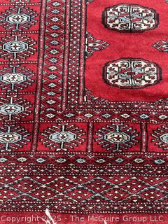 Hand Knotted Pakistan Bokhara Jhaldar Wool Rug on Red Ground. 5' 7" x 4'