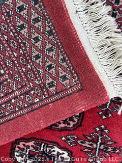 Hand Knotted Pakistan Bokhara Jhaldar Wool Rug on Red Ground. 6' 2" x 3' 3"