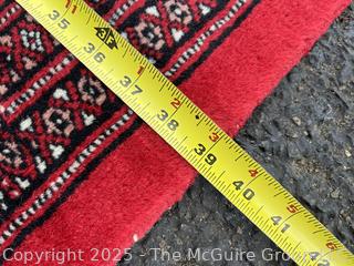 Hand Knotted Pakistan Bokhara Jhaldar Wool Rug on Red Ground. 6' 2" x 3' 3"