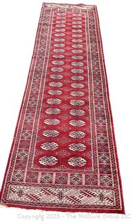 Hand-Knotted Pakistani Bokhara Wool Runner Rug on Red Ground. 31" x 111"