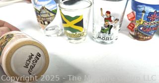 Group Including African Masks and Shot Glasses