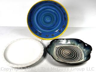 Three Round Pottery Serving Platters, One by Christian Dior. 