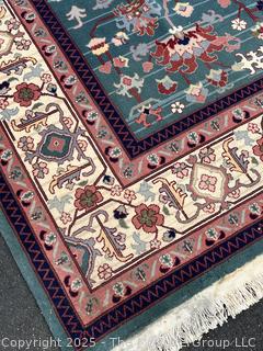 Hand-knotted Wool Tabriz Rug on Blue Ground with Red Border. 94 x 124"