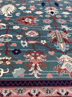 Hand-knotted Wool Tabriz Rug on Blue Ground with Red Border. 94 x 124"