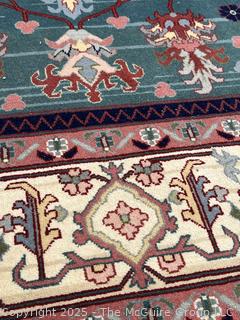 Hand-knotted Wool Tabriz Rug on Blue Ground with Red Border. 94 x 124"