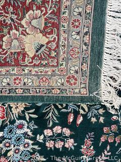 Hand-knotted Persian Tabriz Wool Rug on Green Ground. 109 x 156”
