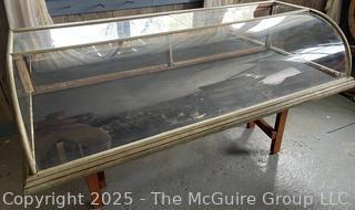 Curved Glass and Plexiglass  Countertop Display Cabinet w/ Two Fold Down Hinged Panels on Back. Missing one Panel of Glass as Shown in Photos 58"L<br>

<br><br>

Removal Options:<br><br> Sat (Nov 8) & Sun (Nov 9) 11-3pm, 56 Scotch Hill Rd., Cambridge NY 12816<br><br>

