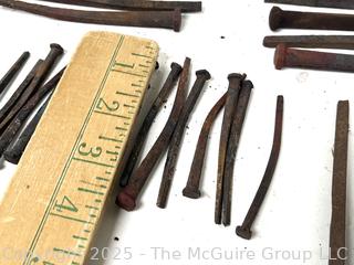 Group of Hammered Square Carpentry Nails<br>

<br><br>

Removal Options:<br><br> Sat (Nov 8) & Sun (Nov 9) 11-3pm, 56 Scotch Hill Rd., Cambridge NY 12816<br><br>

Sat (Nov 15) 12-2pm, TMG Warehouse, 2800 Juniper St., Fairfax, VA 22031<br><br>

Request Shipping (david@themcguiregroupllc.com)