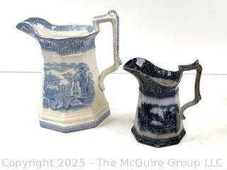 Two (2) Staffordshire Blue Transferware Pitchers<br>

<br><br>

Removal Options:<br><br> Sat (Nov 8) & Sun (Nov 9) 11-3pm, 56 Scotch Hill Rd., Cambridge NY 12816<br><br>

Sat (Nov 15) 12-2pm, TMG Warehouse, 2800 Juniper St., Fairfax, VA 22031<br><br>

Request Shipping (david@themcguiregroupllc.com) 