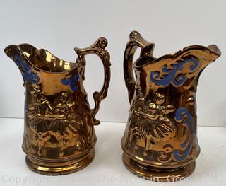 Two (2) Porcelain Lusterware Pitchers<br>

<br><br>

Removal Options:<br><br> Sat (Nov 8) & Sun (Nov 9) 11-3pm, 56 Scotch Hill Rd., Cambridge NY 12816<br><br>

Sat (Nov 15) 12-2pm, TMG Warehouse, 2800 Juniper St., Fairfax, VA 22031<br><br>

Request Shipping (david@themcguiregroupllc.com)