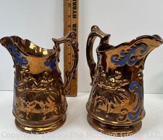 Two (2) Porcelain Lusterware Pitchers<br>

<br><br>

Removal Options:<br><br> Sat (Nov 8) & Sun (Nov 9) 11-3pm, 56 Scotch Hill Rd., Cambridge NY 12816<br><br>

Sat (Nov 15) 12-2pm, TMG Warehouse, 2800 Juniper St., Fairfax, VA 22031<br><br>

Request Shipping (david@themcguiregroupllc.com)